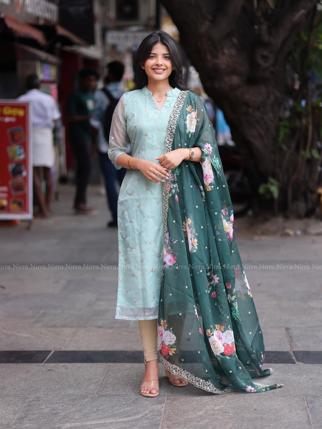 Flaunt in our turquoise green organza top paired with floral shawl salwar set