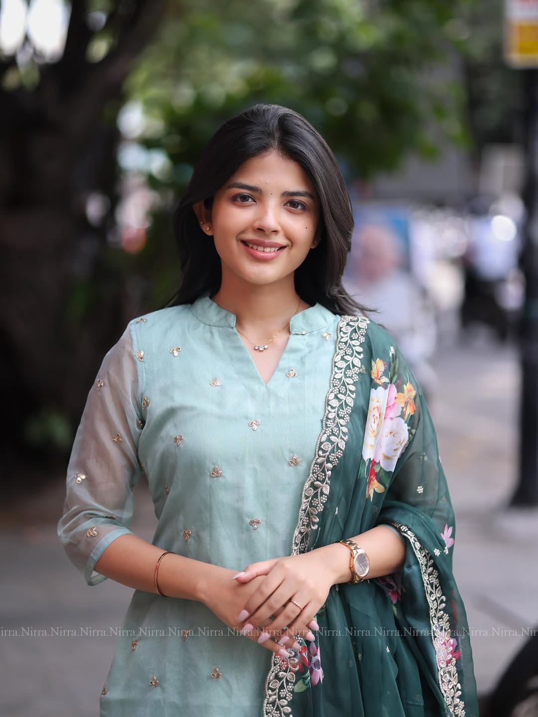 Flaunt in our turquoise green organza top paired with floral shawl salwar set